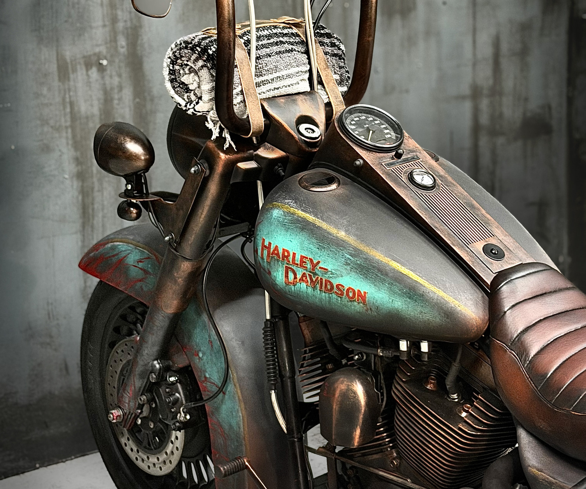 Detail of the Road King Roadkill tank with hand-painted Harley-Davidson lettering and patina finish