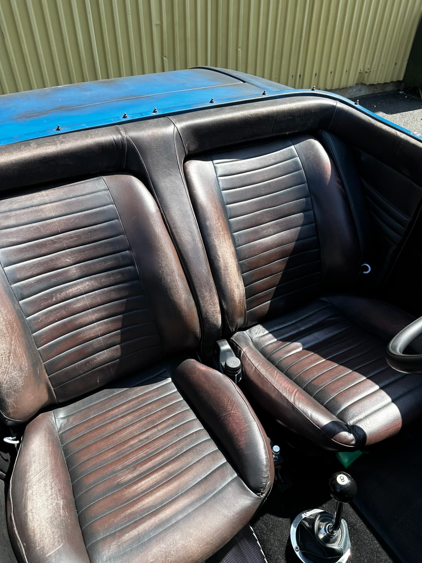 Brown leather interior of the '32 Ford Roadster with eight-ball shifter