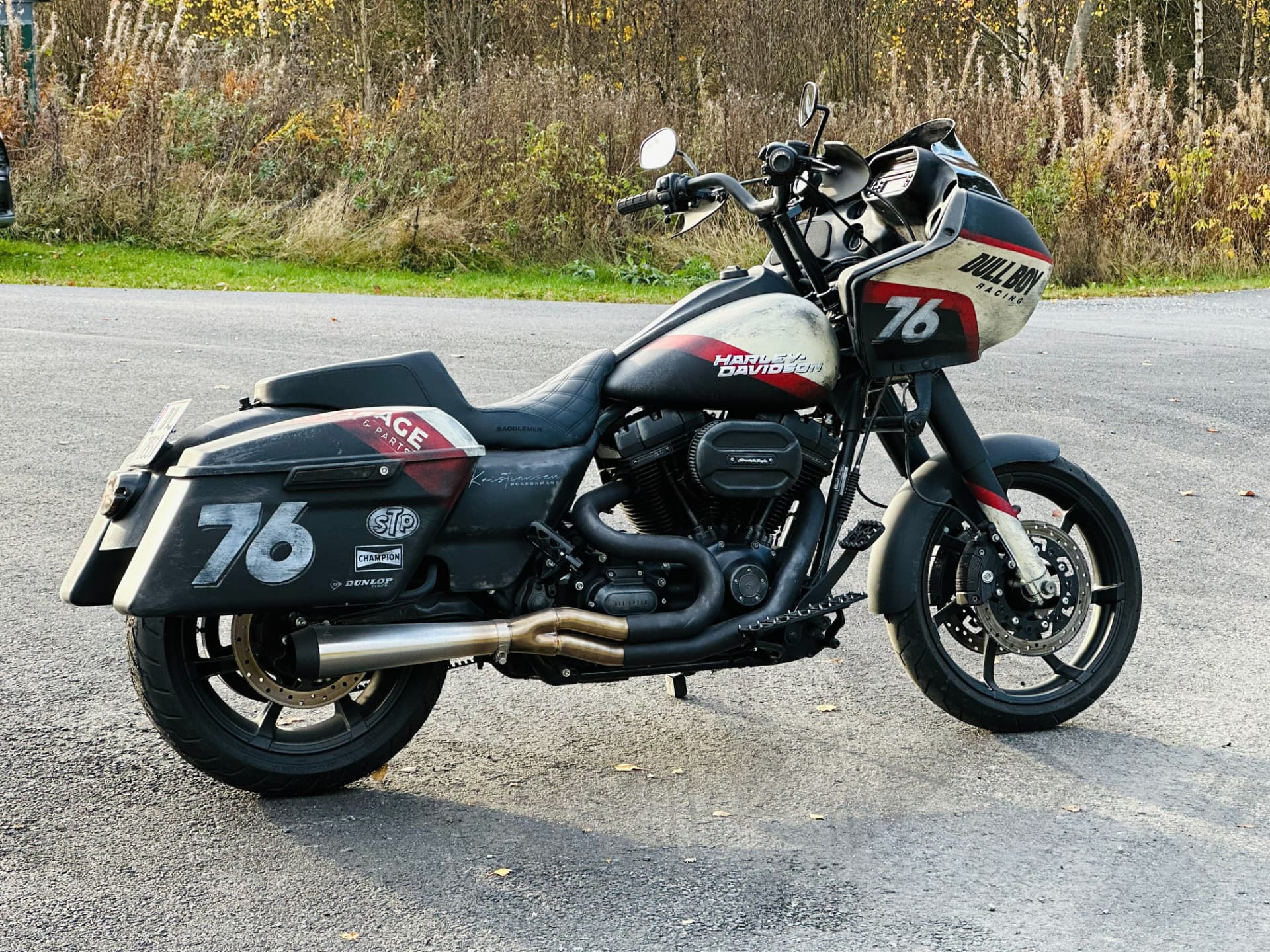 Left side view of the performance bagger with hand-painted 76 saddlebag