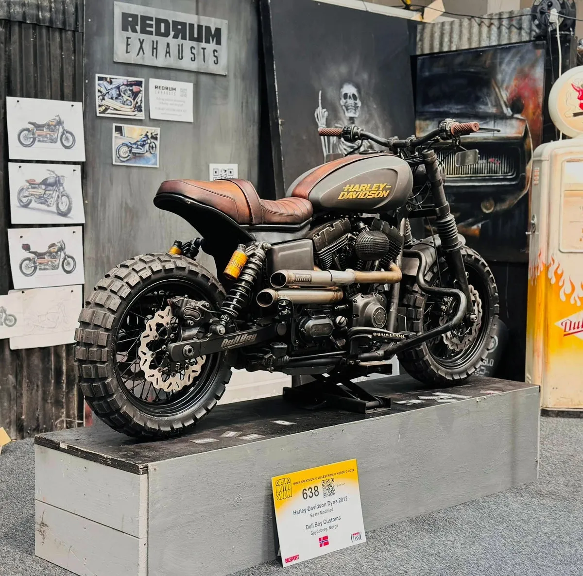 Dyna Scrambler custom motorcycle — a Harley-Davidson Dyna converted into a street scrambler with knobby tires and high pipes.