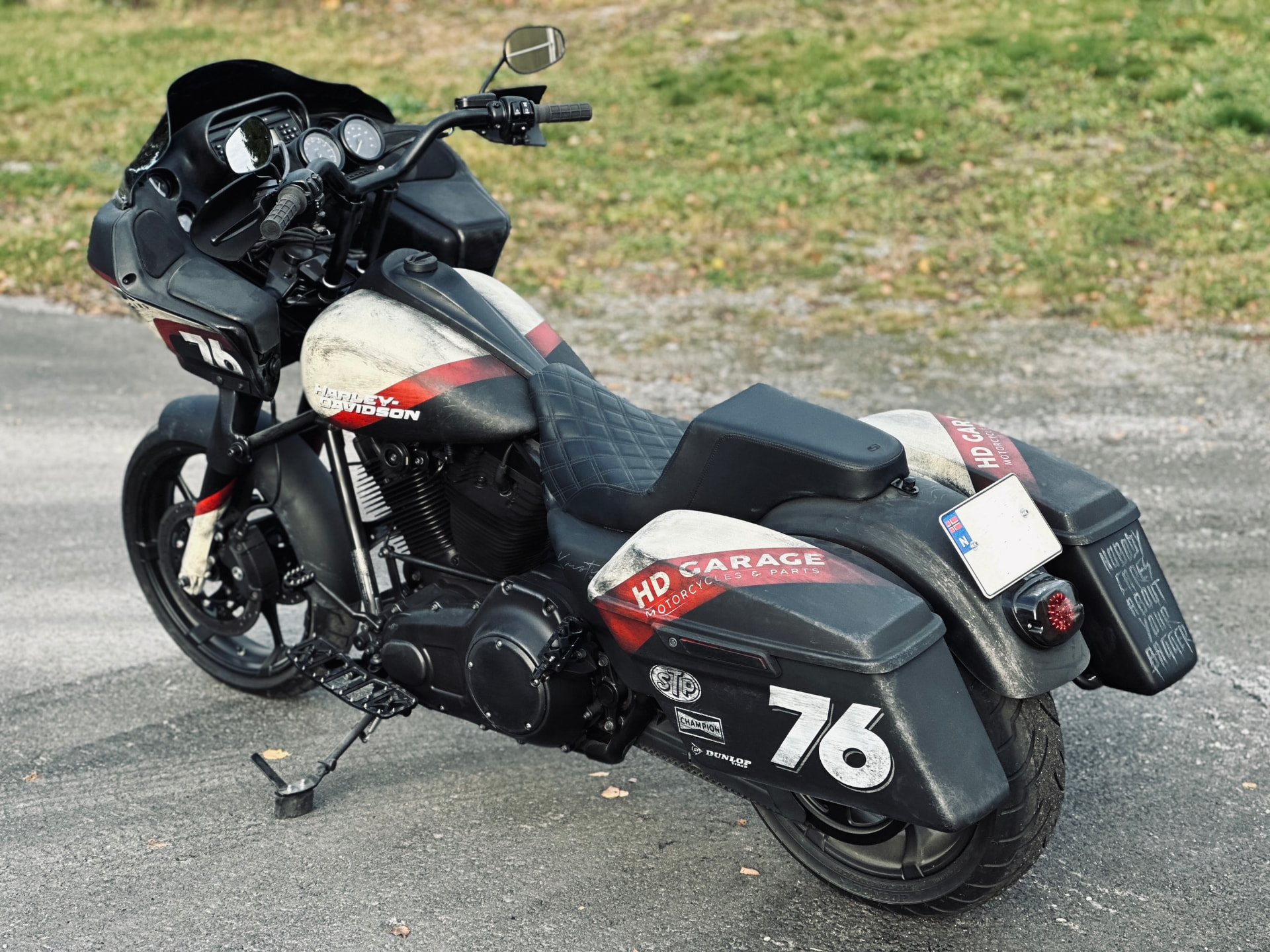 Rear three-quarter view showing the HD Garage saddlebag graphics