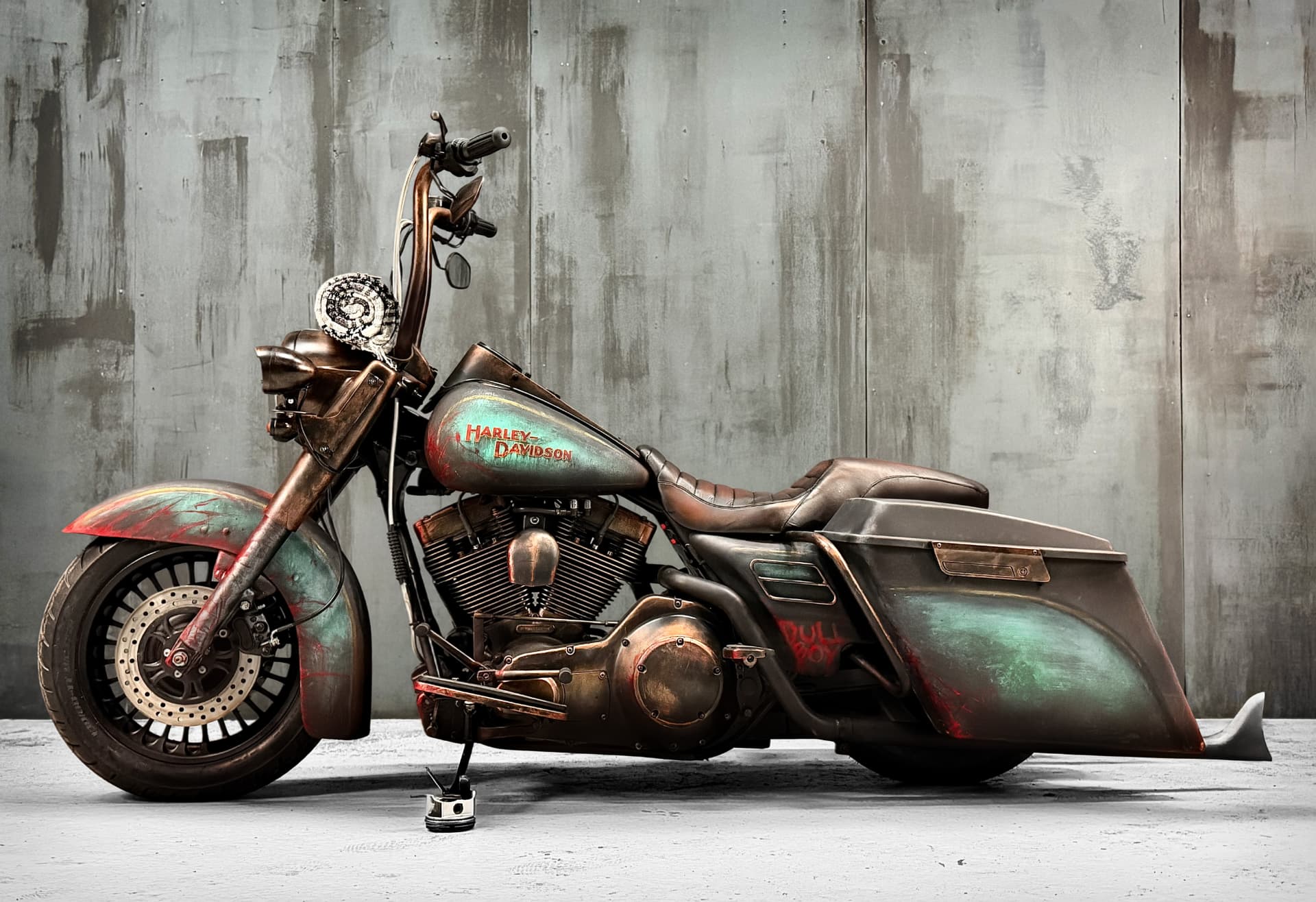 Side profile of the Road King Roadkill against a concrete wall