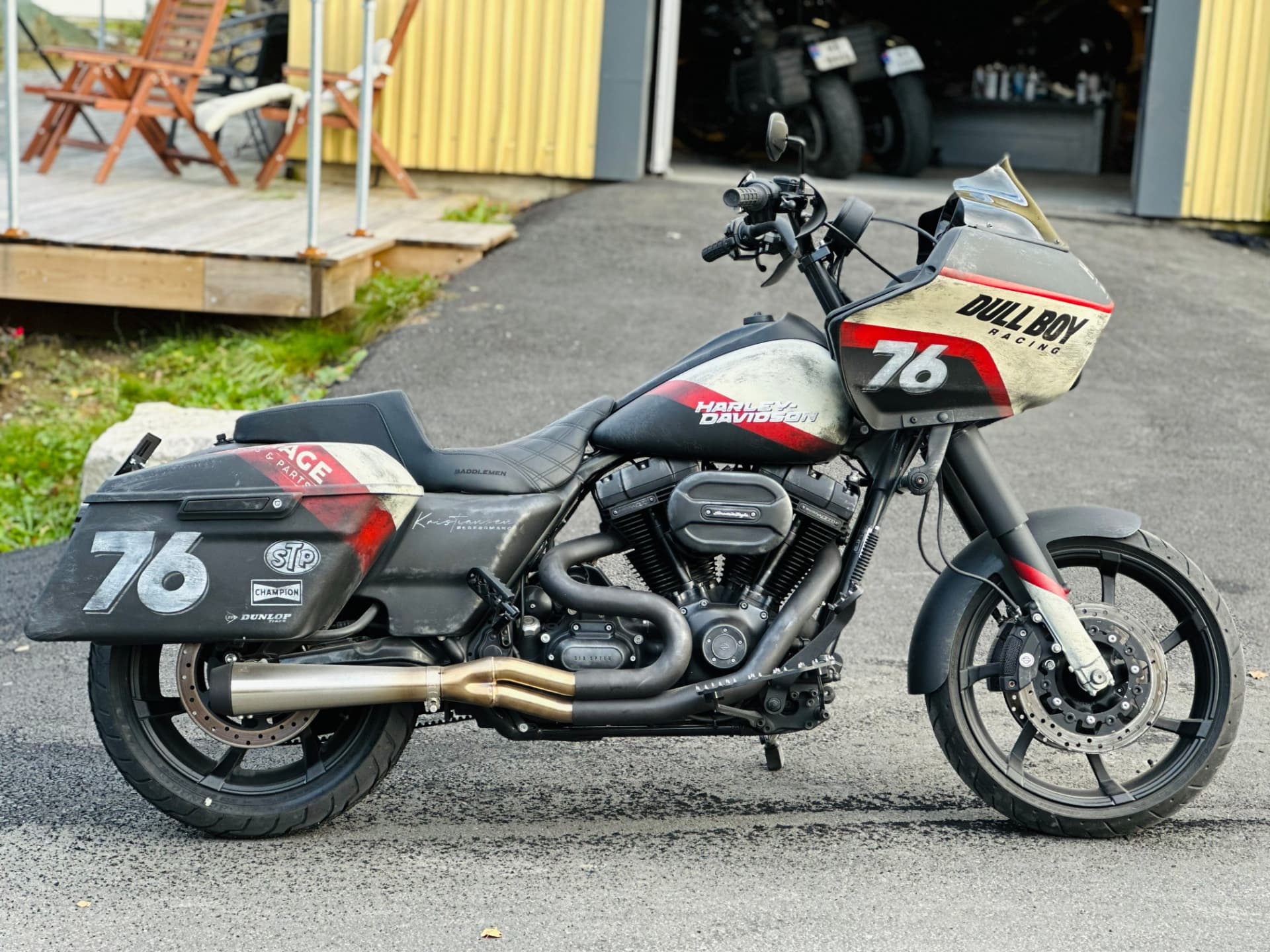 Side profile of the performance bagger outside the workshop