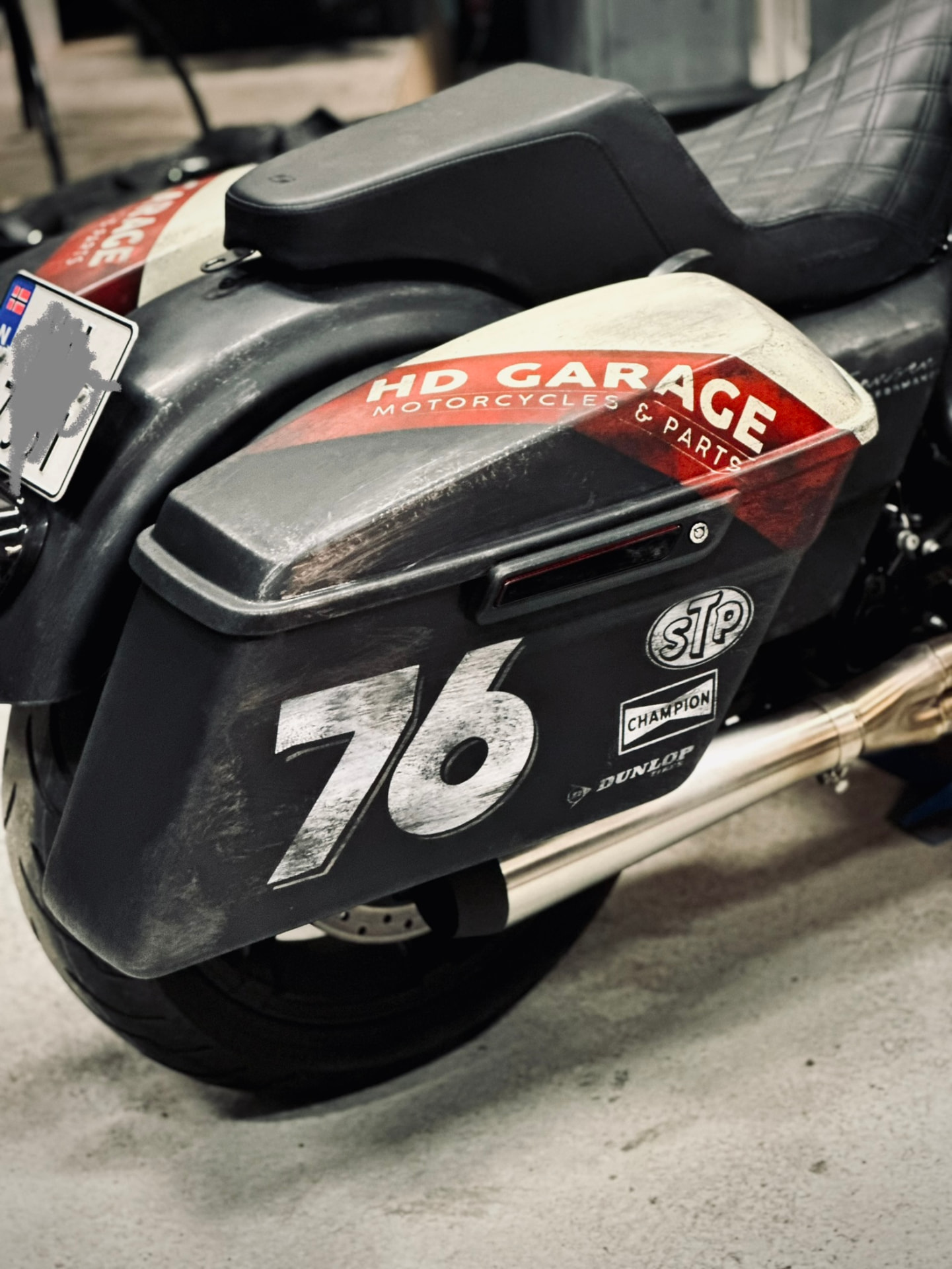 Close-up of the hand-painted HD Garage and 76 saddlebag graphics