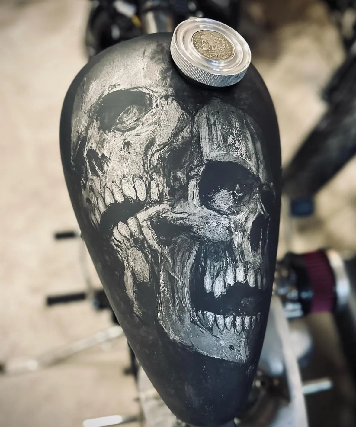 Hand-painted double skull on a matte black tank